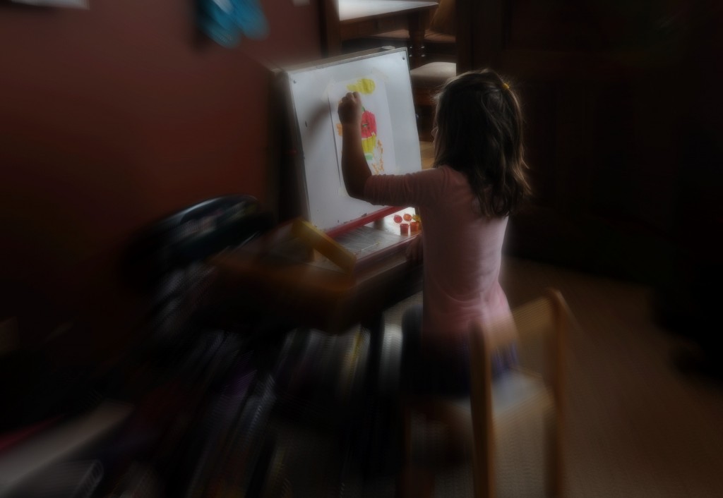 child at easel