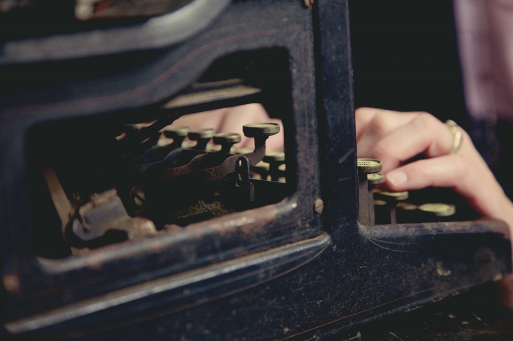 hands on old typewriter