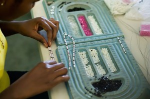 making jewelry, Haitian women
