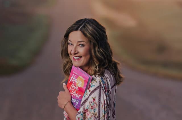 Jennifer Dukes Lee holding a copy of How to Love Your Morning